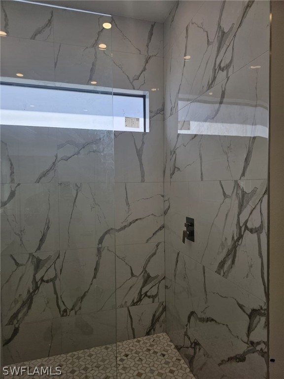 3685 Randall Boulevard Naples, FL 34120 - Photo 9 of 32 a bathroom with a shower