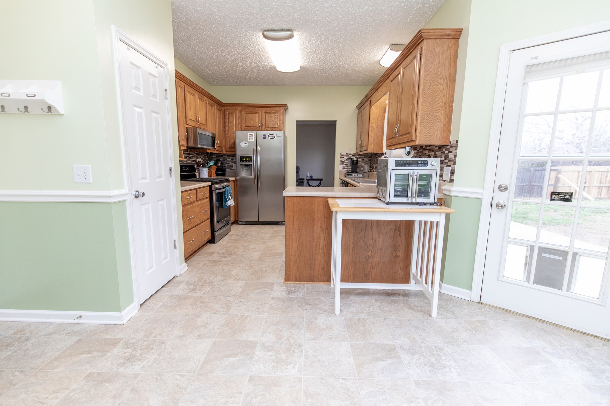 1417 Fairfield Road Westmoreland, TN 37186 - Photo 12 of 47 Each door on the back of the house has a doggie door for your favorite fur baby to the fenced in yard