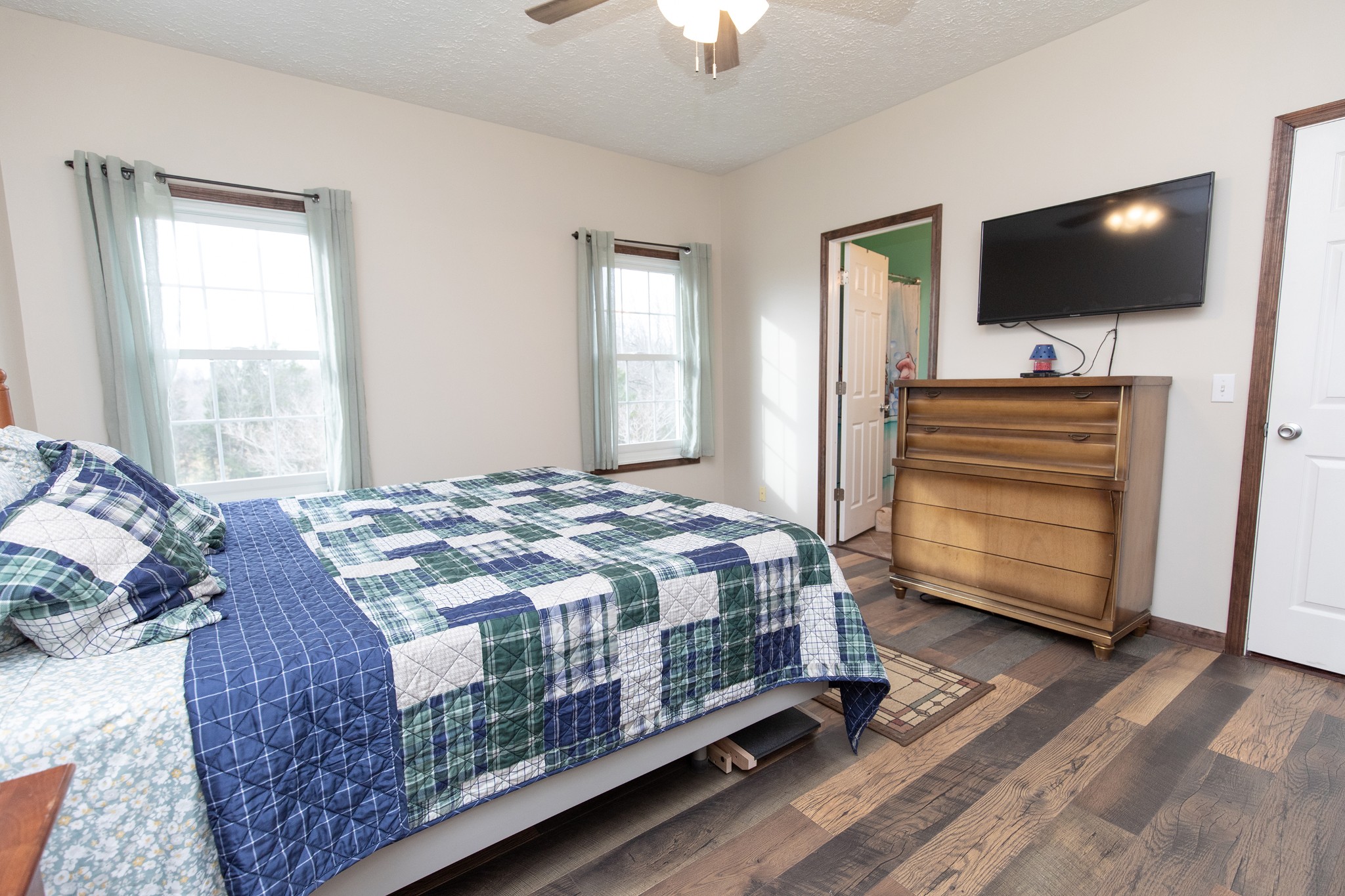 1417 Fairfield Road Westmoreland, TN 37186 - Photo 15 of 47 Primary bedroom has plenty of space, new flooring, great natural light and it's private bath and walk in closet