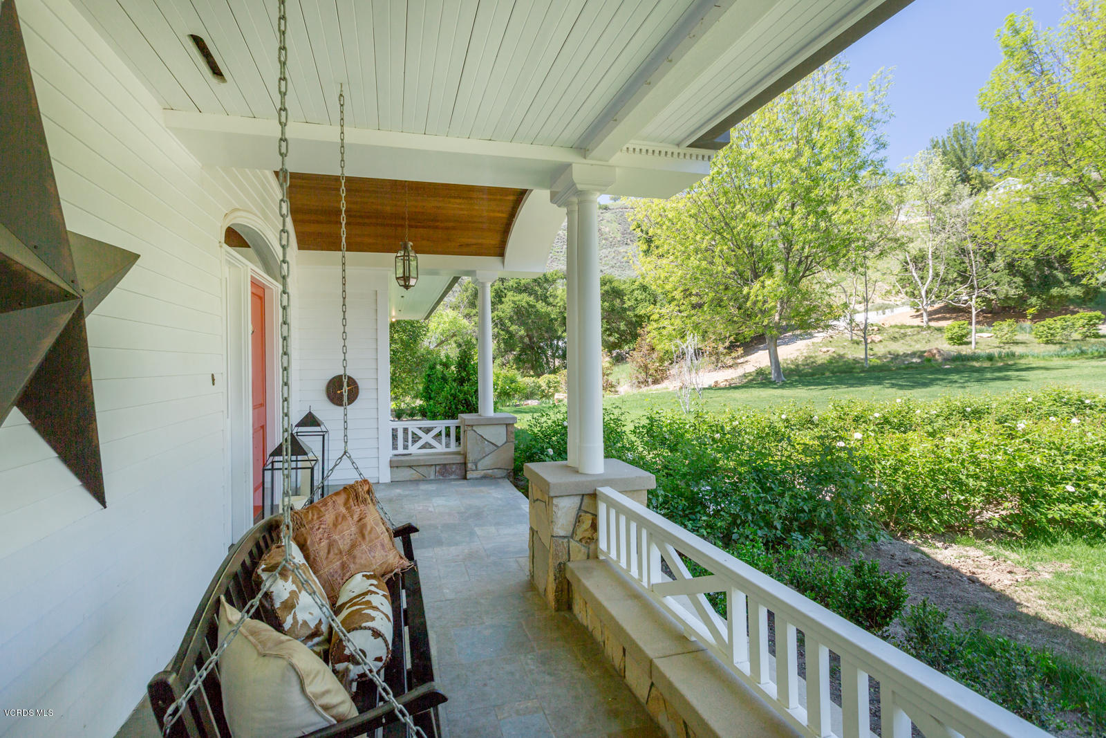 24900 Paseo Del Rancho Road Calabasas, CA 91302 - Photo 11 of 46 a view of a porch with furniture and garden