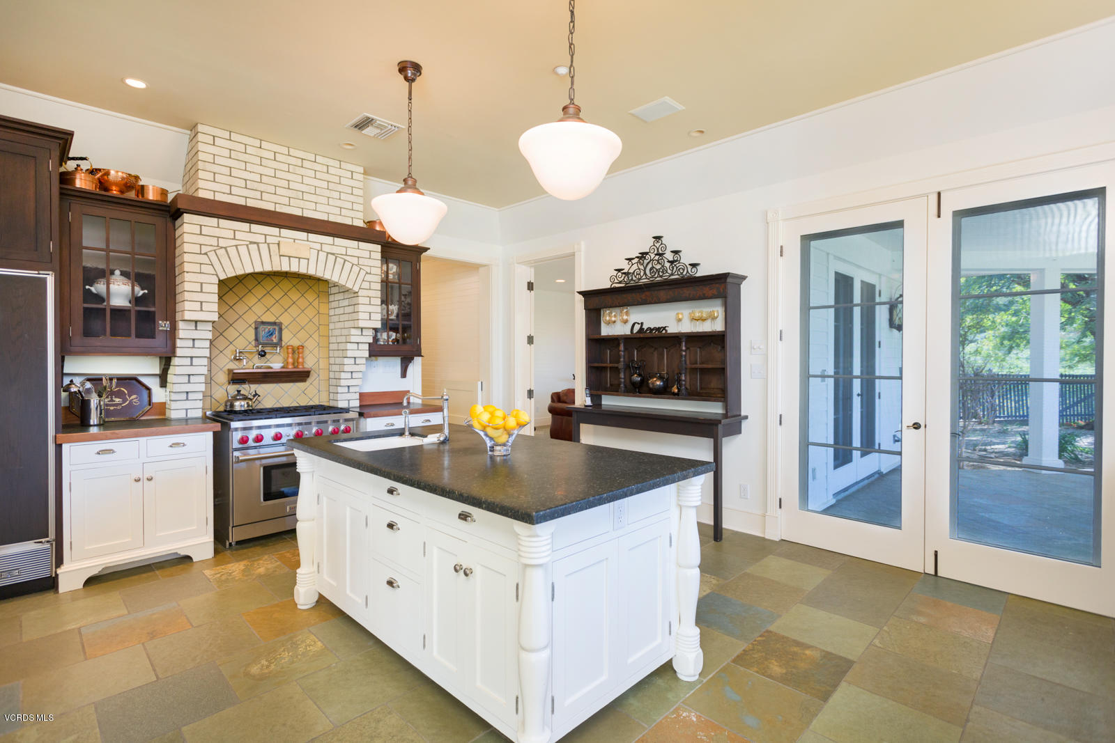 24900 Paseo Del Rancho Road Calabasas, CA 91302 - Photo 18 of 46 a kitchen with stainless steel appliances granite countertop a sink a stove and a refrigerator