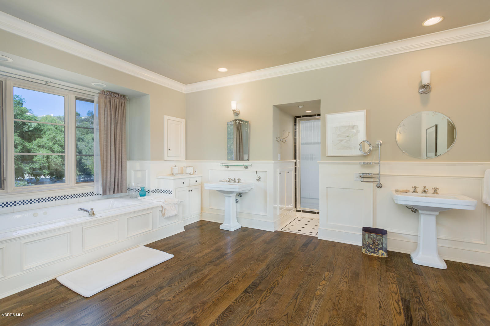 24900 Paseo Del Rancho Road Calabasas, CA 91302 - Photo 26 of 46 a spacious bathroom with a tub sink and mirror