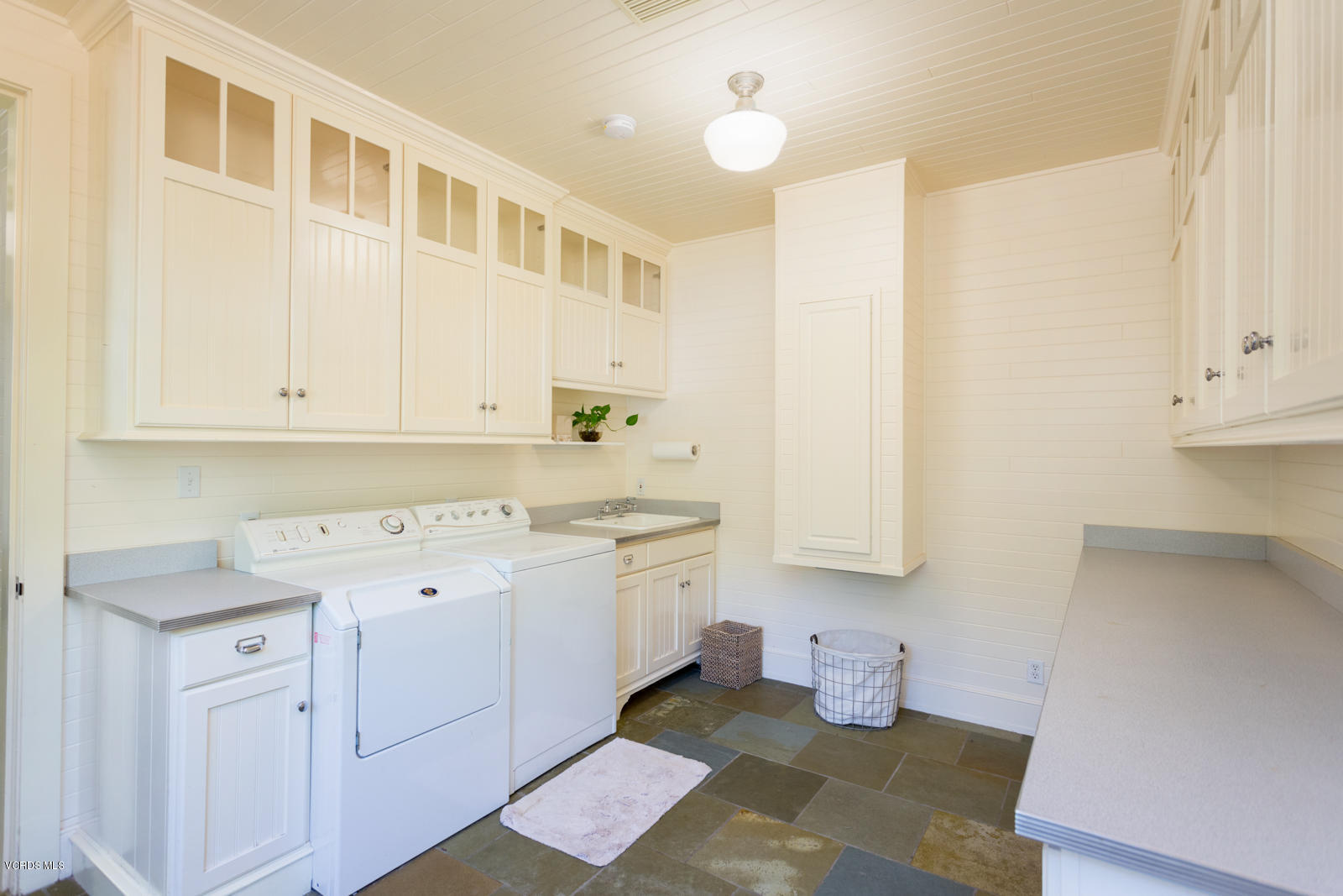 24900 Paseo Del Rancho Road Calabasas, CA 91302 - Photo 31 of 46 a kitchen with a sink and cabinets