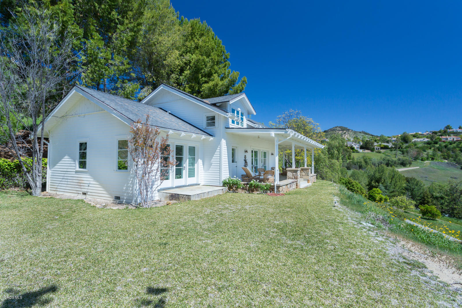 24900 Paseo Del Rancho Road Calabasas, CA 91302 - Photo 34 of 46 a view of a house with backyard porch and sitting area