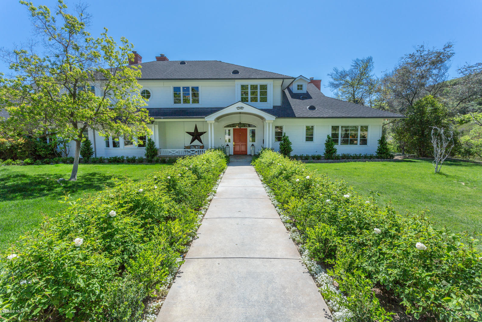24900 Paseo Del Rancho Road Calabasas, CA 91302 - Photo 9 of 46 front view of a house with a yard