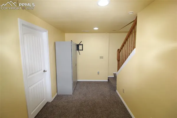 a room with a baby crib and a couch