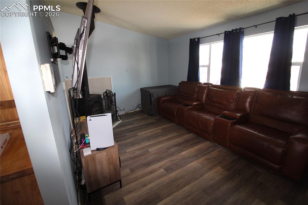 16855 Sage Crest Road Peyton, CO 80831 - Photo 2 of 27 a living room with furniture and a fireplace