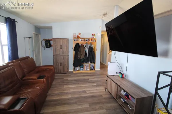 a living room with furniture and a flat screen tv
