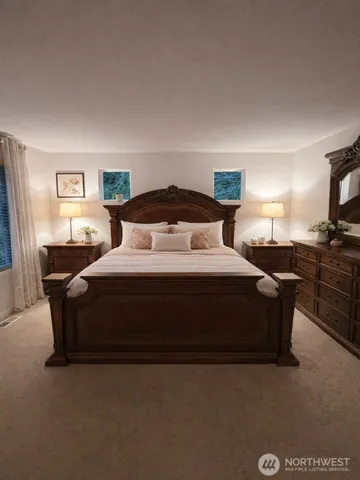 a bedroom with a bed and a night stand