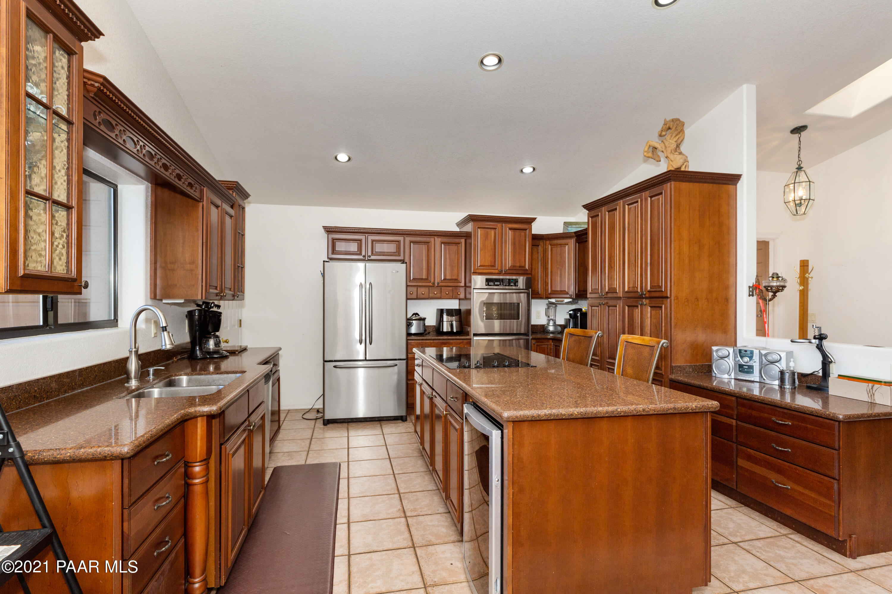 1424 East Valley View Road Prescott, AZ 86303 - Photo 11 of 43 a kitchen with stainless steel appliances granite countertop a sink stove and refrigerator