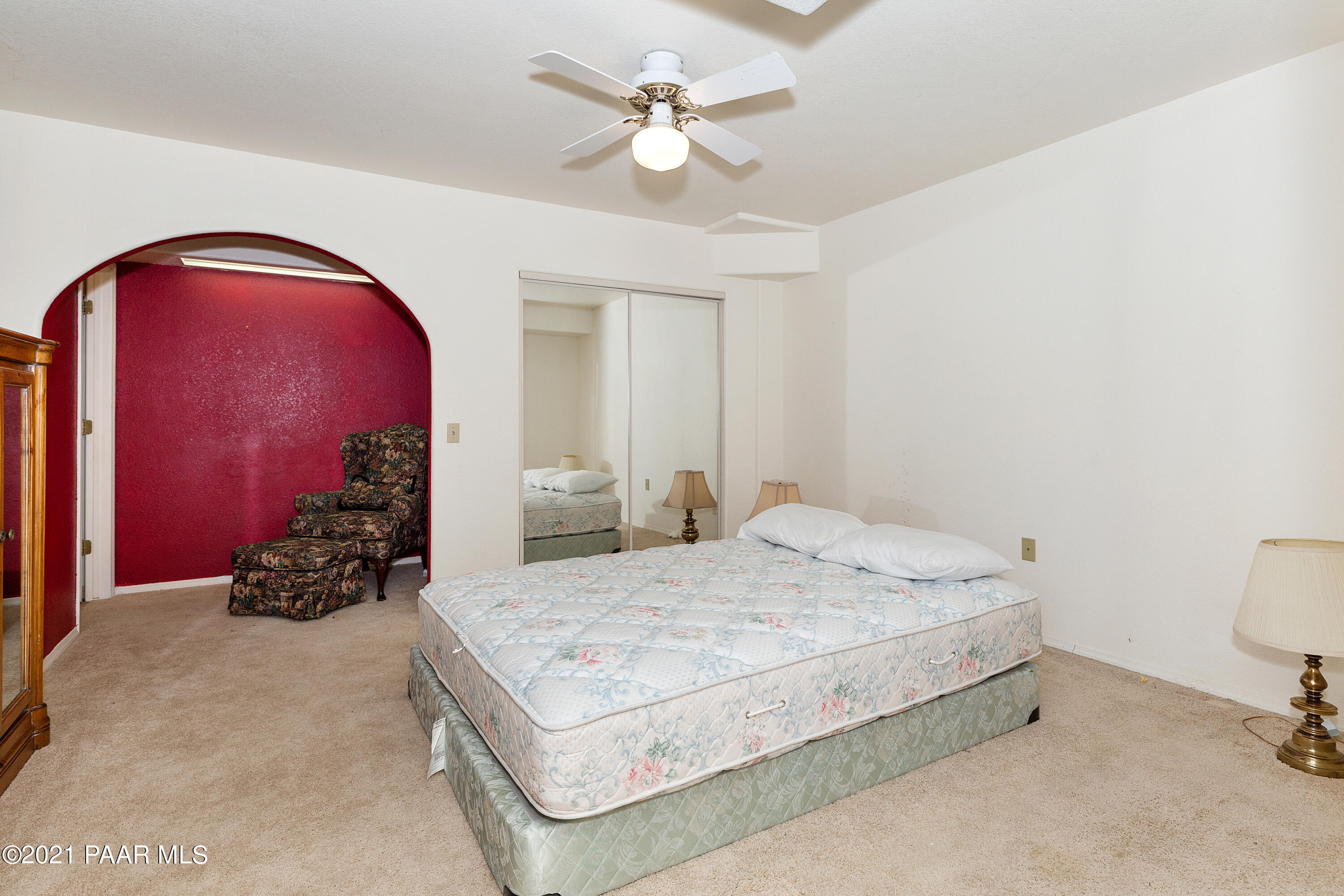 1424 East Valley View Road Prescott, AZ 86303 - Photo 25 of 43 a spacious bedroom with a bed and a chandelier