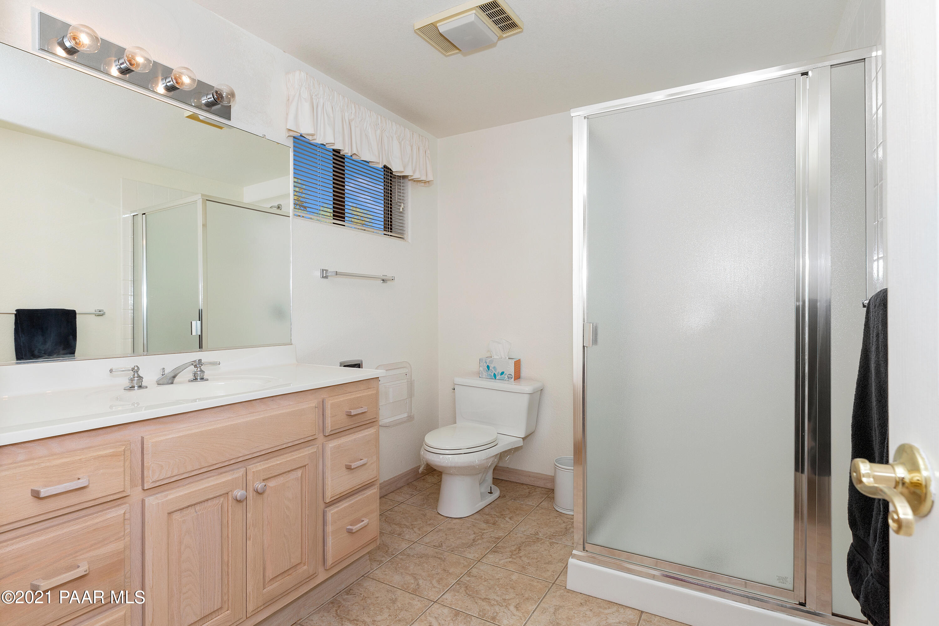 1424 East Valley View Road Prescott, AZ 86303 - Photo 27 of 43 a bathroom with a double vanity sink toilet and a mirror