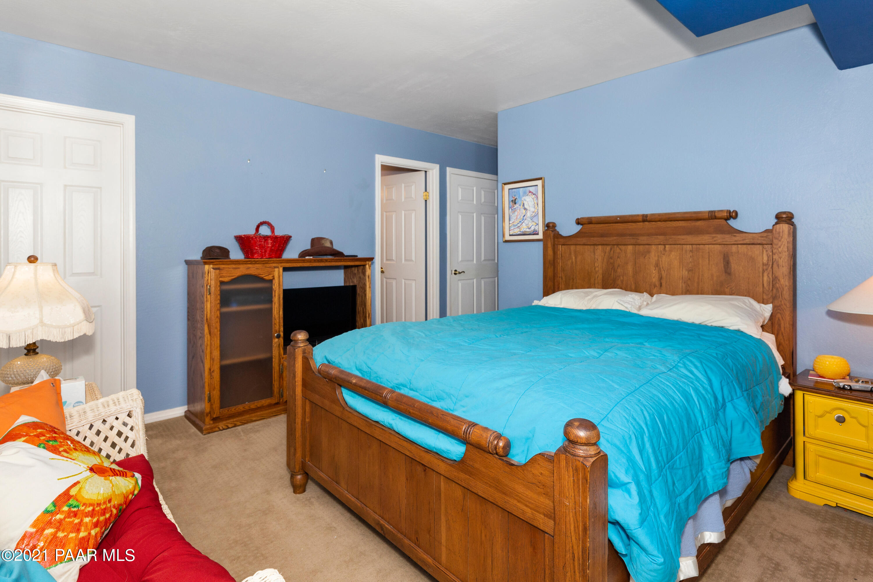 1424 East Valley View Road Prescott, AZ 86303 - Photo 29 of 43 a bed sitting in a bedroom next to a window