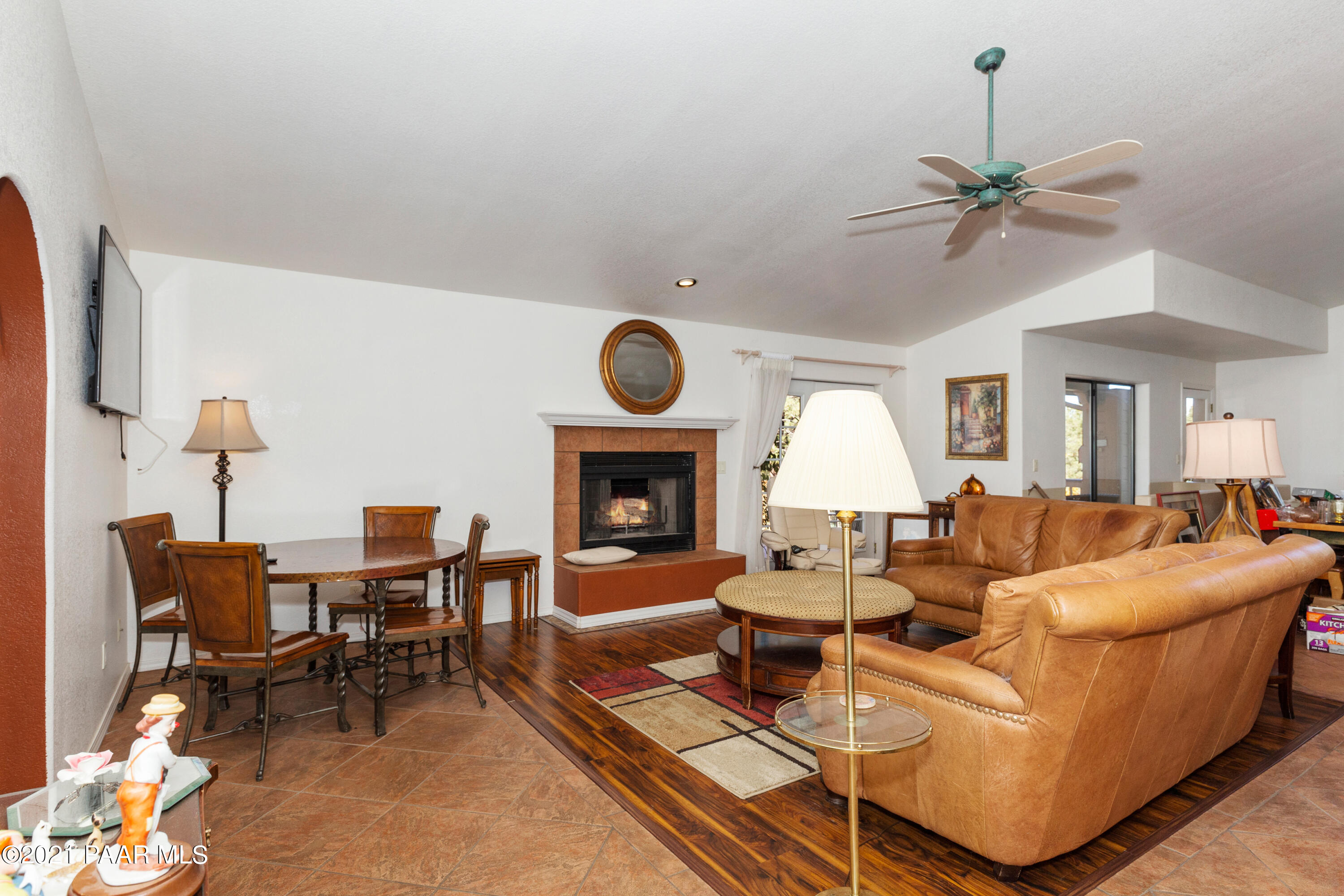 1424 East Valley View Road Prescott, AZ 86303 - Photo 8 of 43 a living room with furniture a fireplace and a chandelier