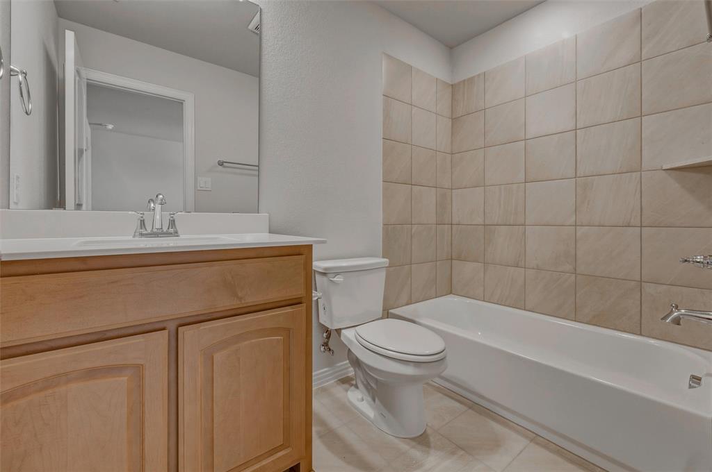 1337 Frio Drive Springtown, TX 76082 - Photo 31 of 40 Wood-finish vanity with an integrated sink and chrome faucet