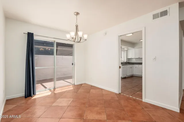 a view of a room with cabinet and floor to ceiling window