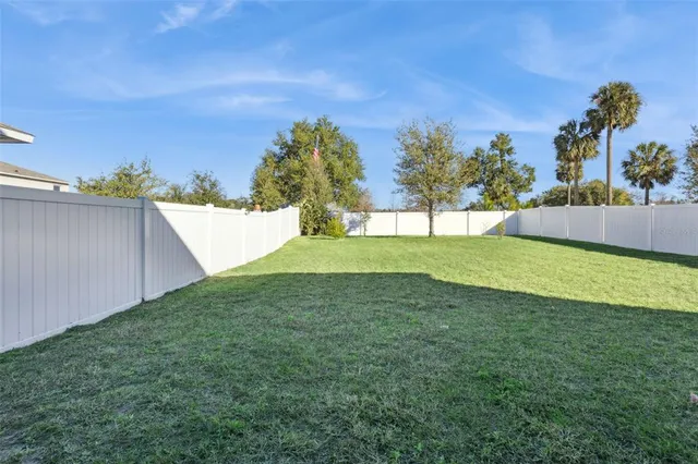 a view of a backyard with an outdoor space