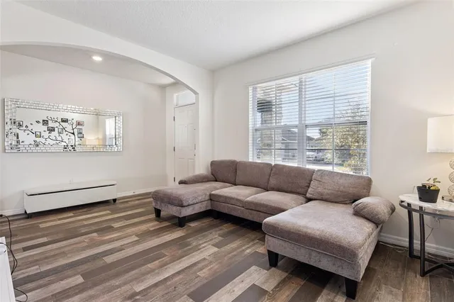 a living room with furniture and a large window