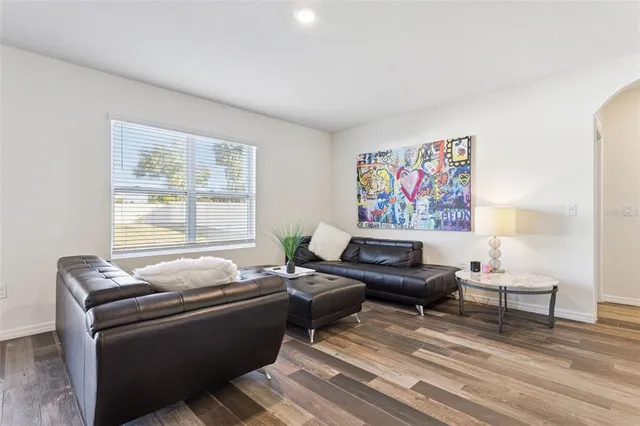 a living room with furniture and a window