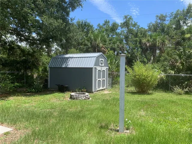 a backyard of a house with seating space
