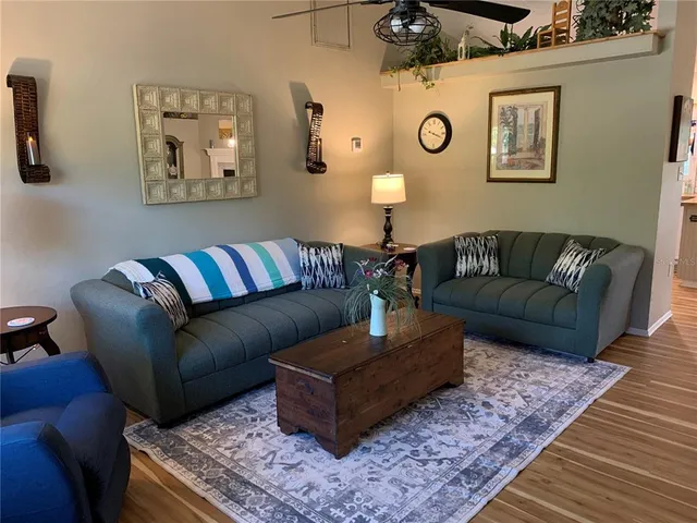 a living room with furniture and a table