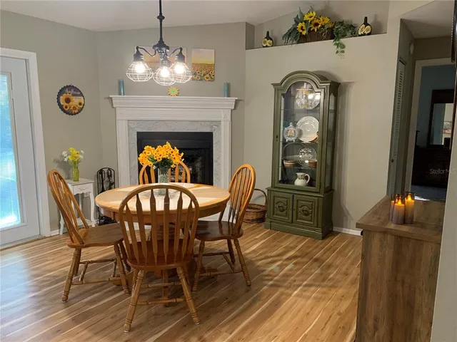 a dining room with furniture and window