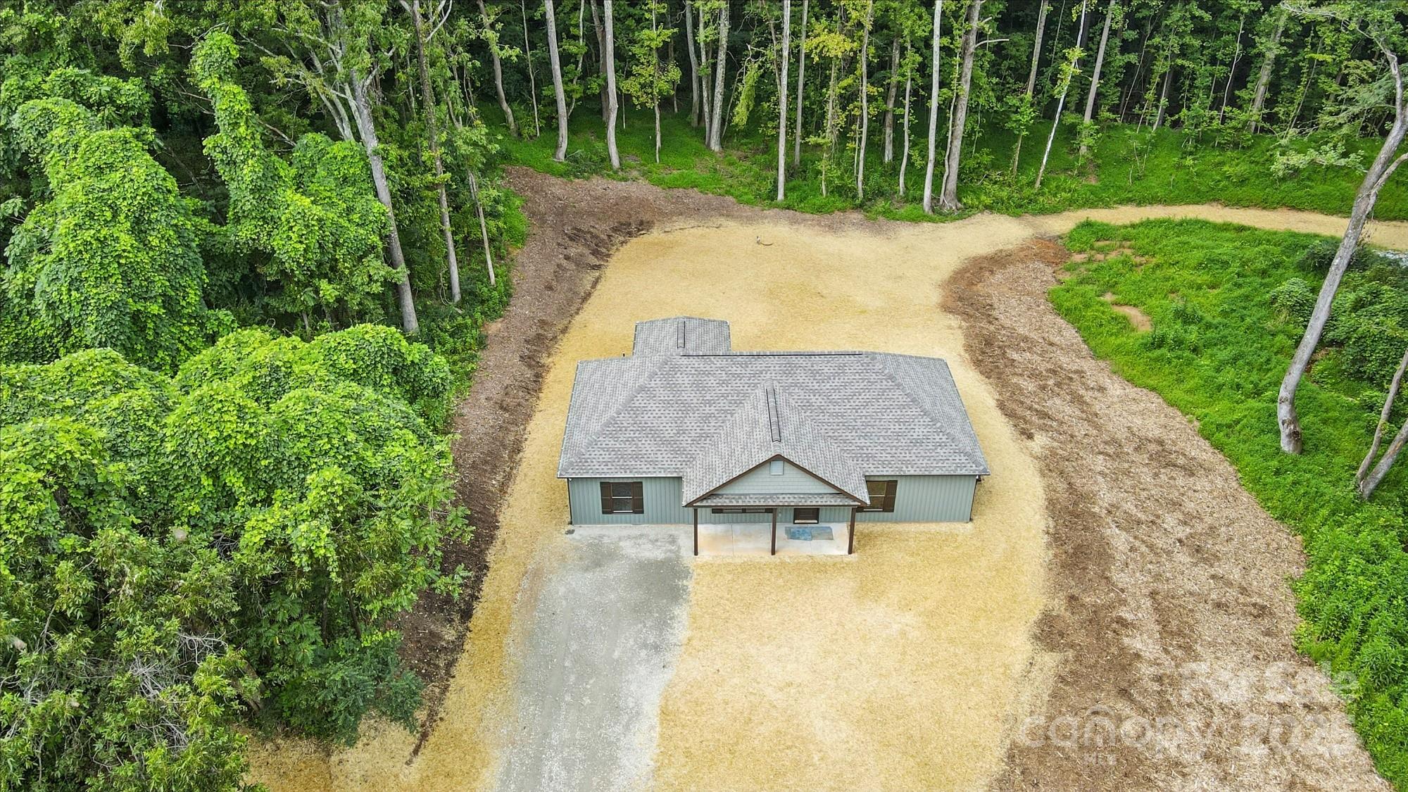 233 Lincoln Road York, SC 29745 - Photo 1 of 37 an aerial view of a house with swimming pool and garden
