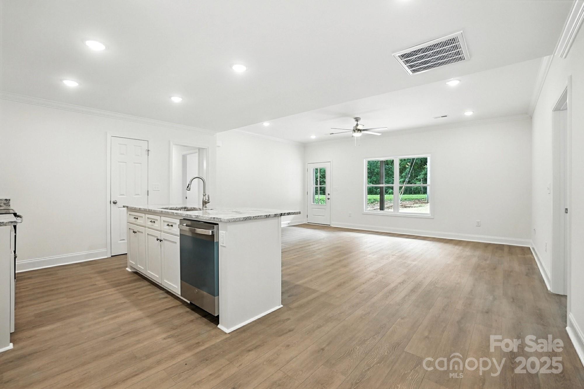 233 Lincoln Road York, SC 29745 - Photo 13 of 37 a view of kitchen with stove and wooden floor