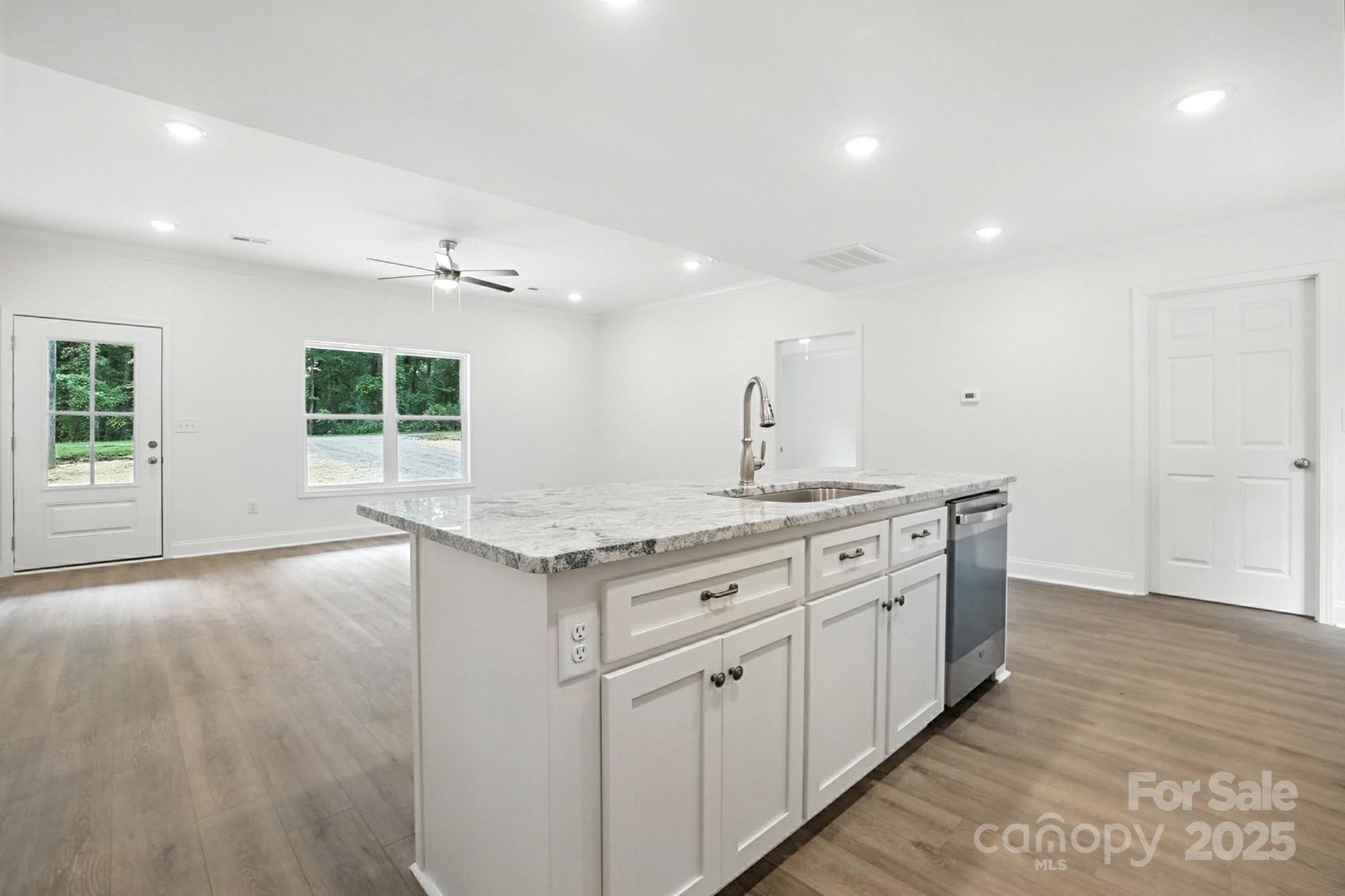 233 Lincoln Road York, SC 29745 - Photo 15 of 37 a kitchen with granite countertop a stove and a sink