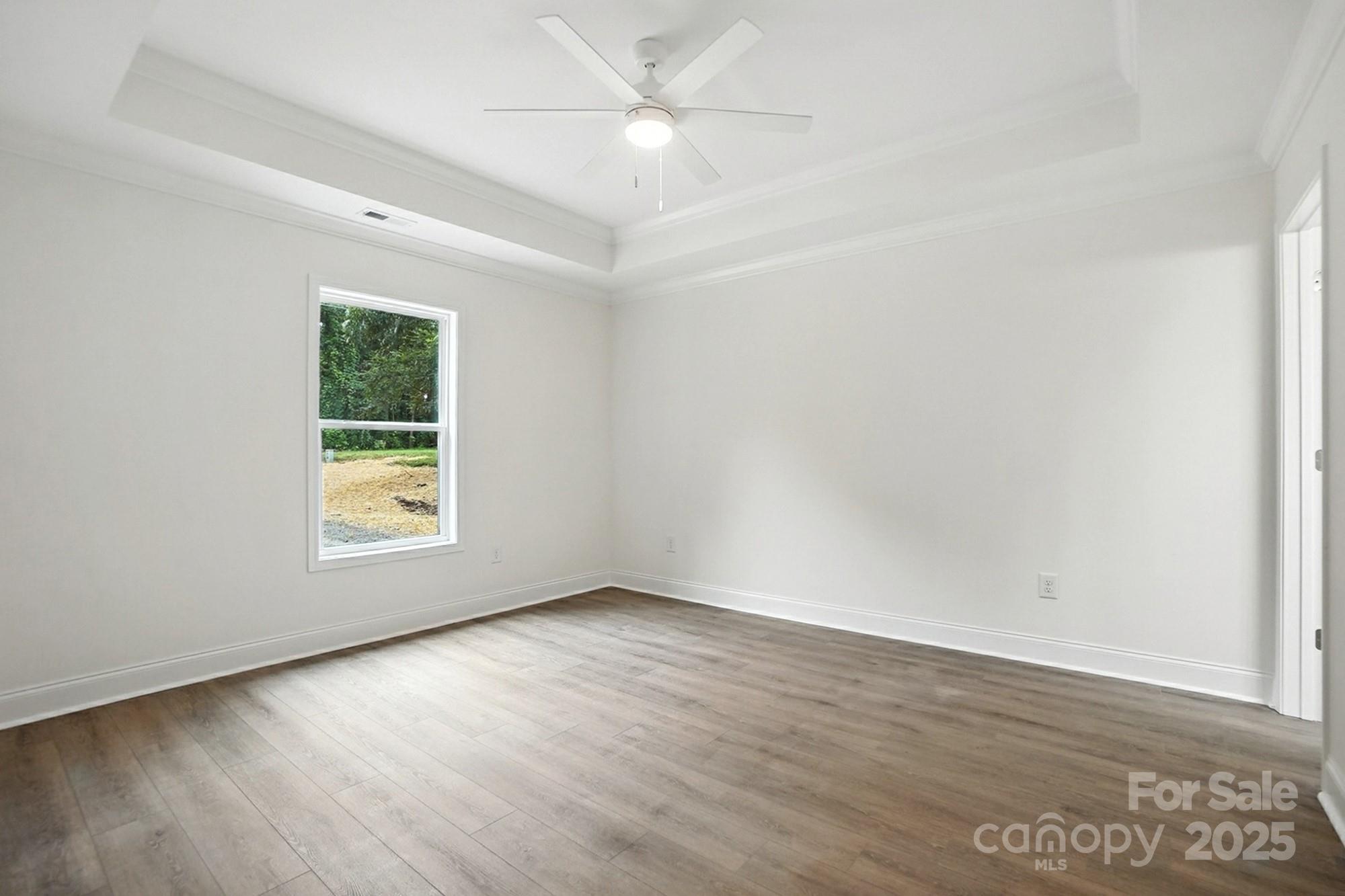 233 Lincoln Road York, SC 29745 - Photo 17 of 37 an empty room with wooden floor and windows