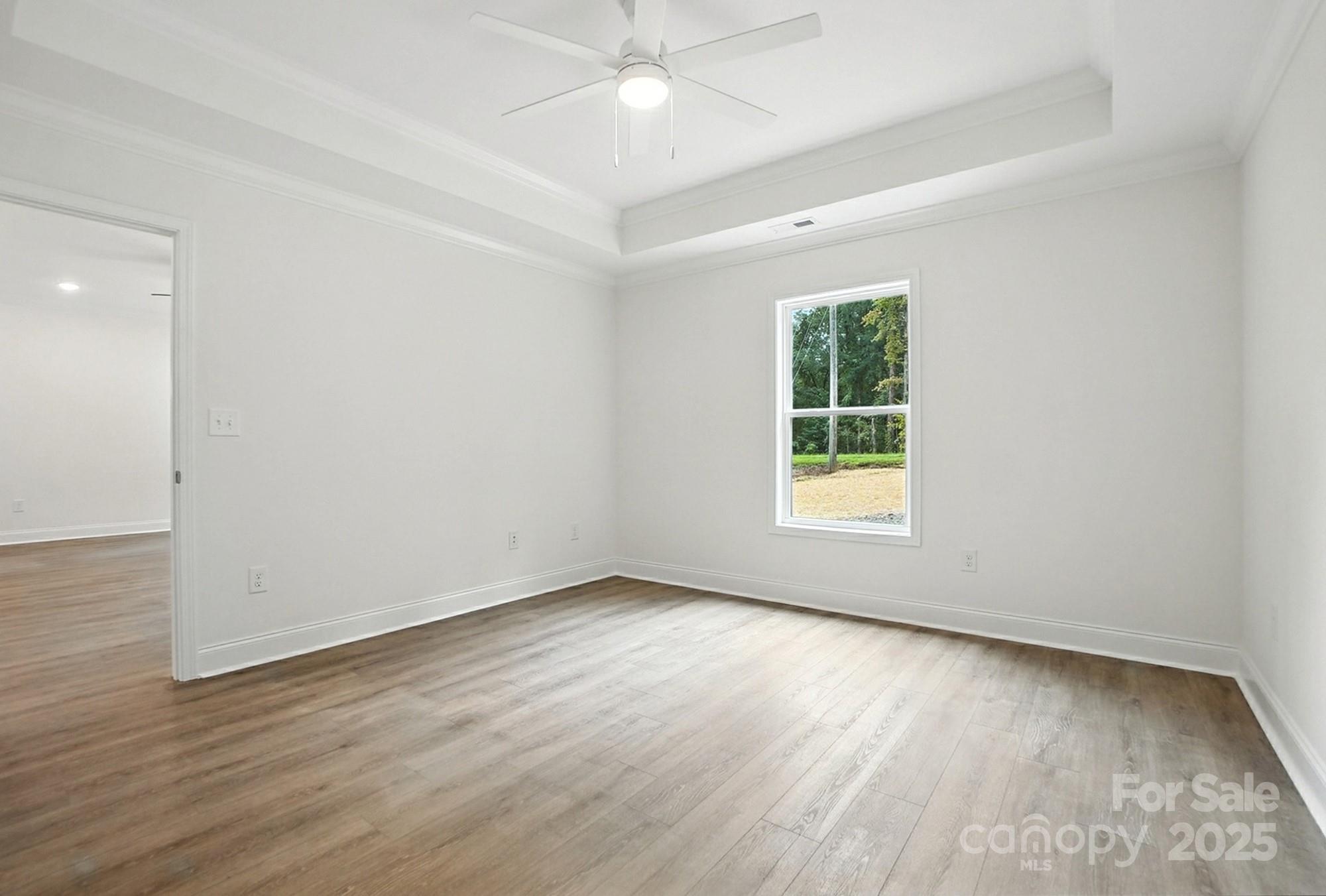 233 Lincoln Road York, SC 29745 - Photo 18 of 37 an empty room with wooden floor and windows