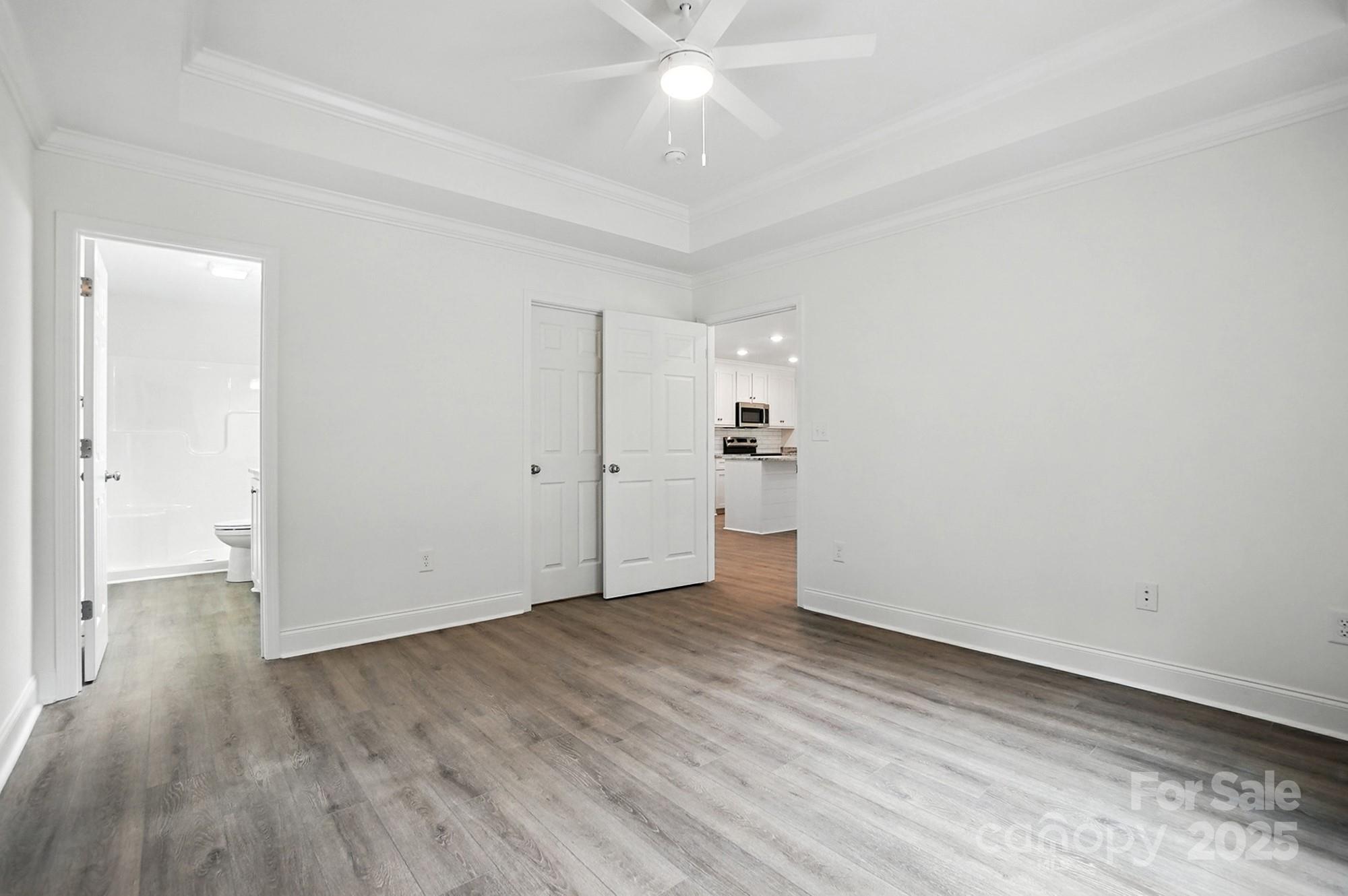 233 Lincoln Road York, SC 29745 - Photo 19 of 37 wooden floor in an empty room with a window