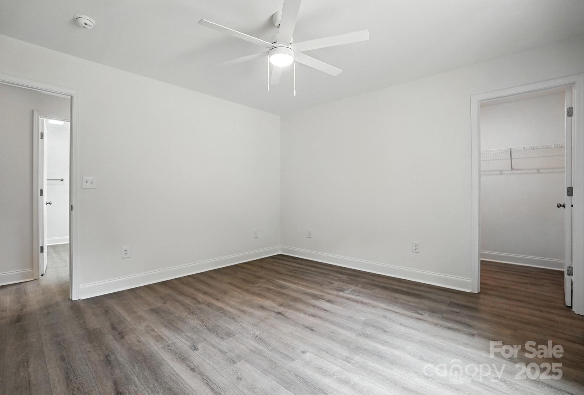233 Lincoln Road York, SC 29745 - Photo 24 of 37 an empty room with wooden floor and fan