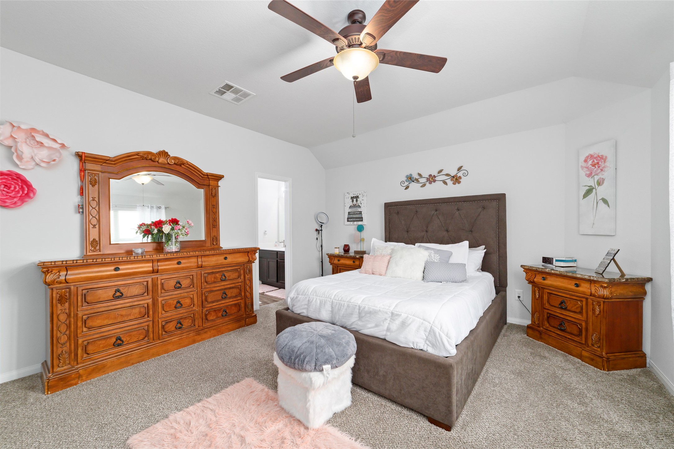 18619 Cooper Ravine Way Katy, TX 77449 - Photo 15 of 23 a bedroom with a large bed and a dresser
