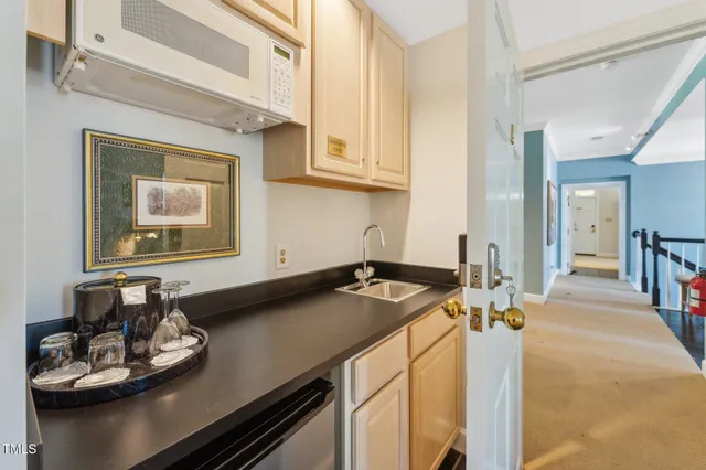 a dining room with a table and chairs