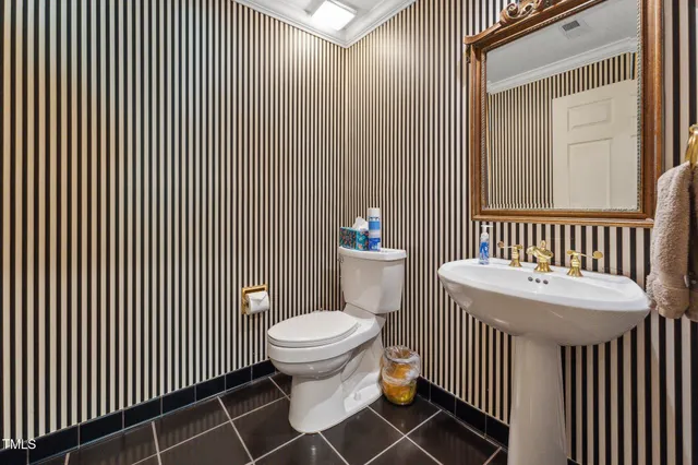 a en suite bathroom with a sink a mirror and a shower