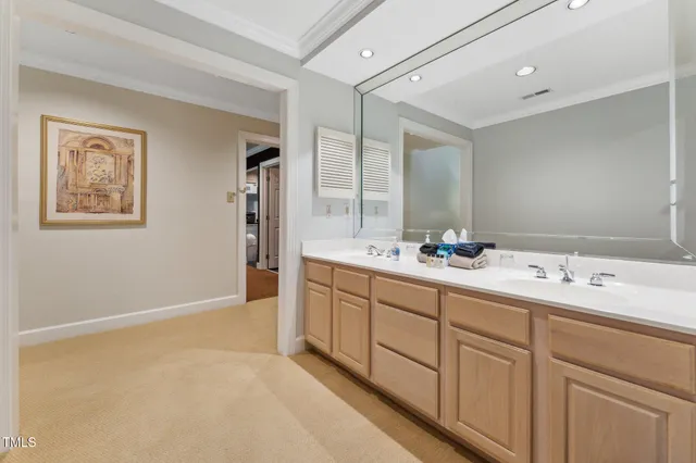 a bathroom with a sink double vanity and a mirror