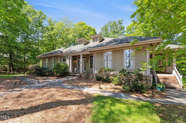 a bathroom with a double vanity sink toilet and a mirror