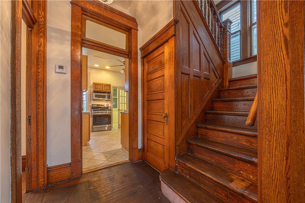 114 Union Street Uniontown, PA 15401 - Photo 22 of 28 a view of a balcony with wooden floor and stairs