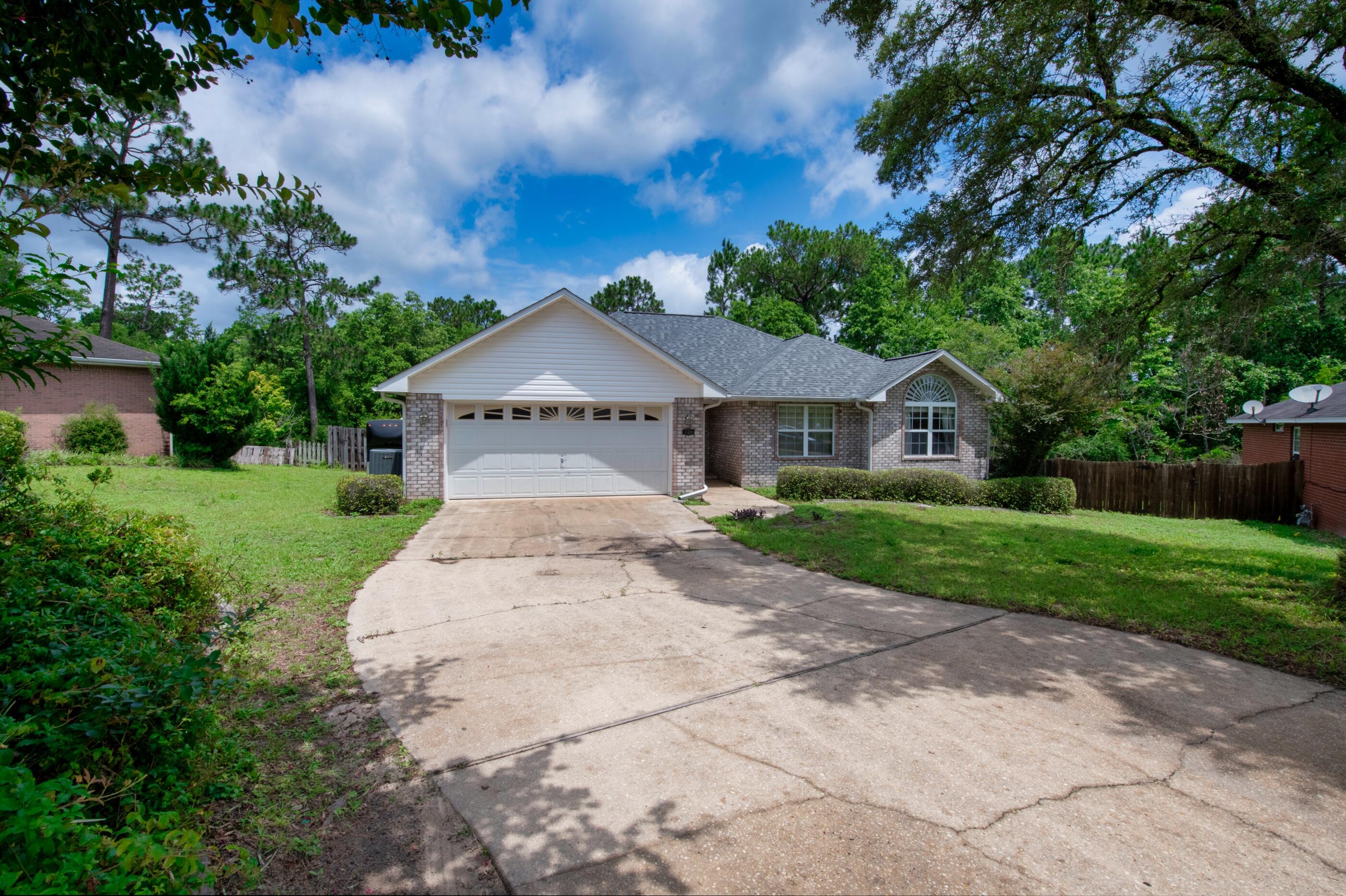 738 Riva Ridge Drive Crestview, FL 32539 - Photo 1 of 23 a front view of a house with yard