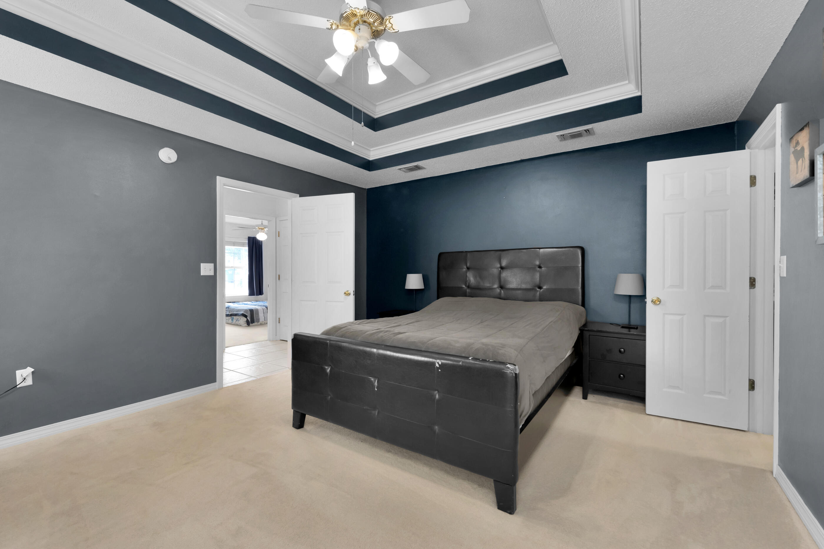 738 Riva Ridge Drive Crestview, FL 32539 - Photo 14 of 23 a bedroom with a bed and a chandelier