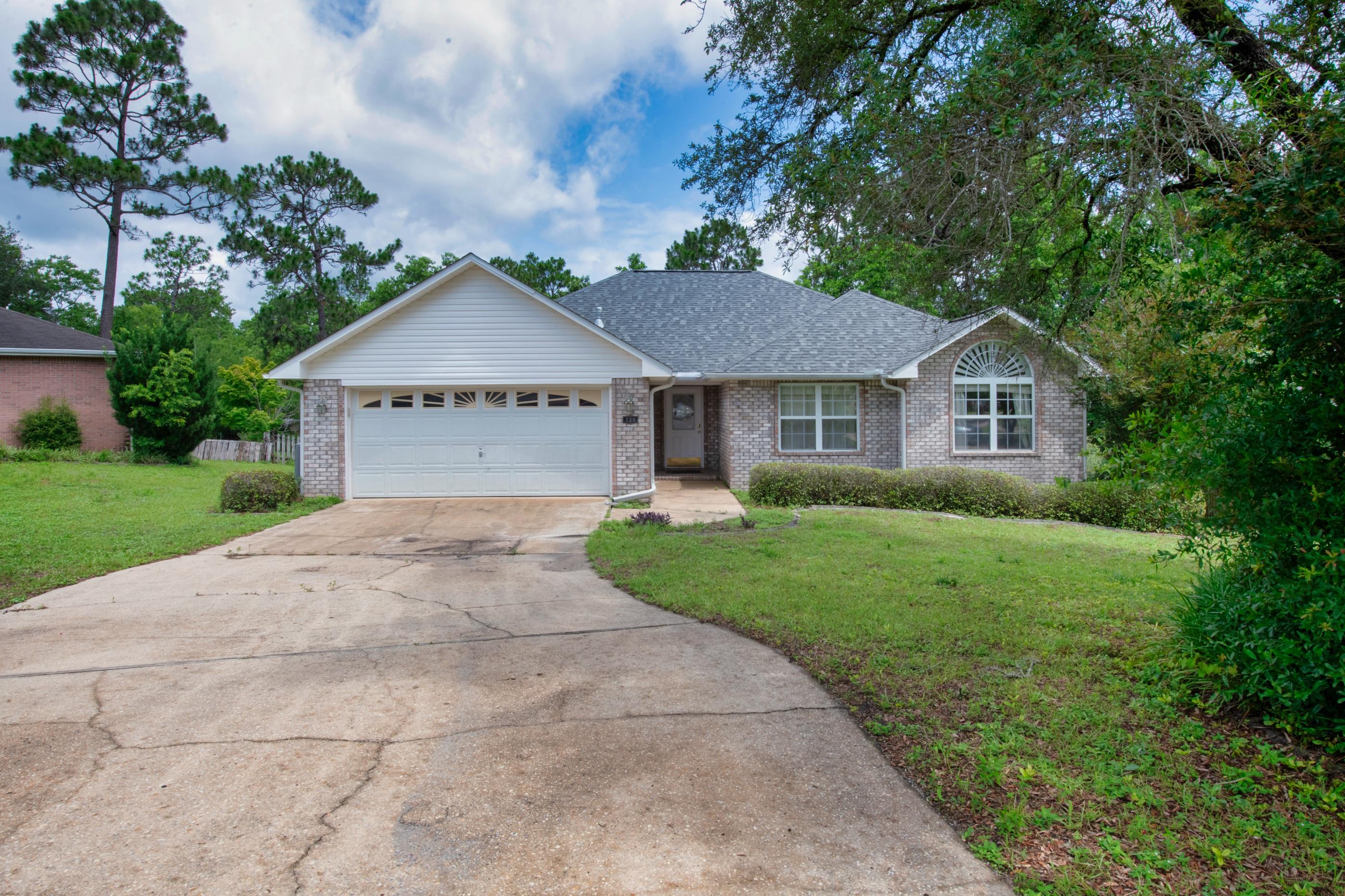 738 Riva Ridge Drive Crestview, FL 32539 - Photo 2 of 23 a front view of a house with a yard