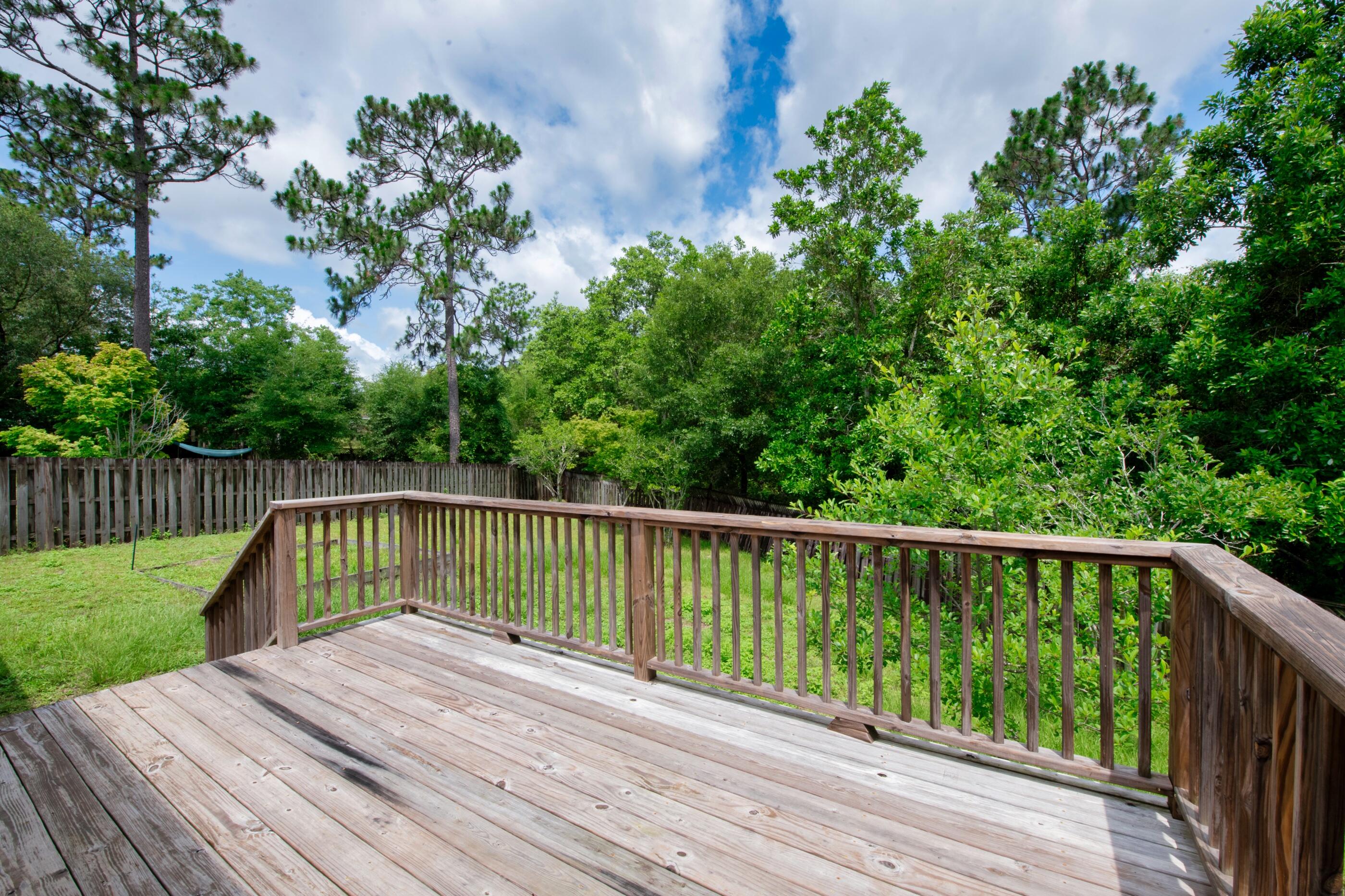 738 Riva Ridge Drive Crestview, FL 32539 - Photo 21 of 23 a view of balcony with wooden floor and fence