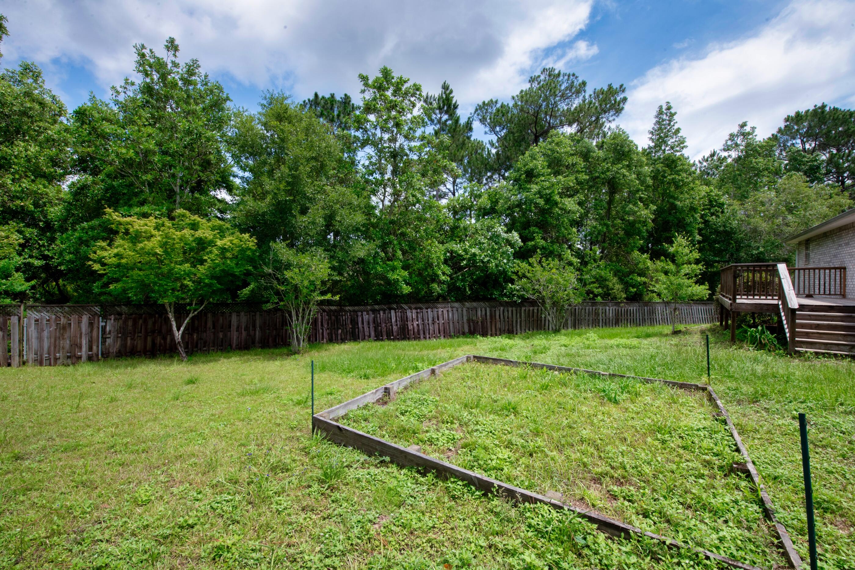 738 Riva Ridge Drive Crestview, FL 32539 - Photo 22 of 23 a view of a backyard with a swing