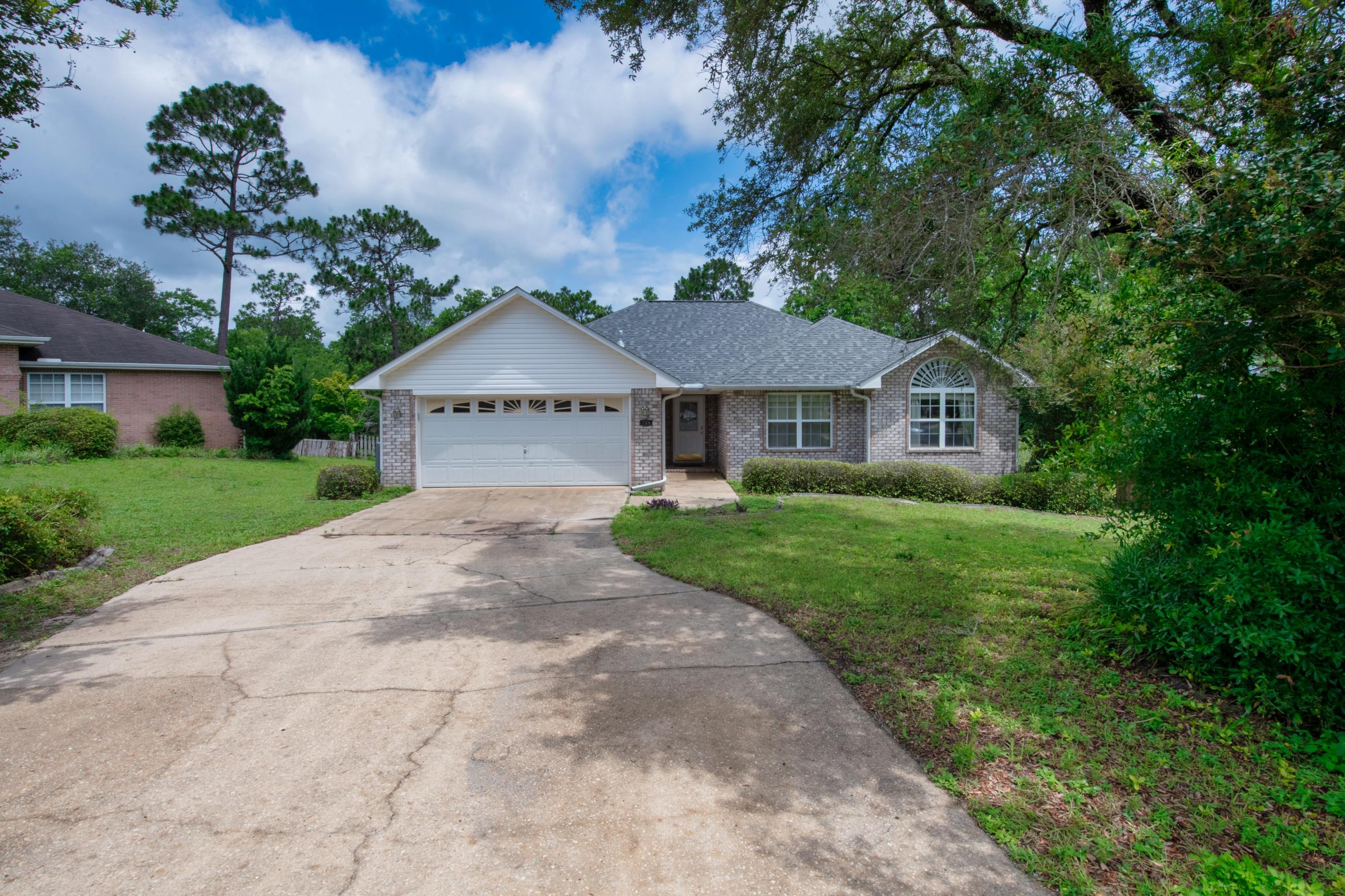 738 Riva Ridge Drive Crestview, FL 32539 - Photo 3 of 23 a front view of a house with yard