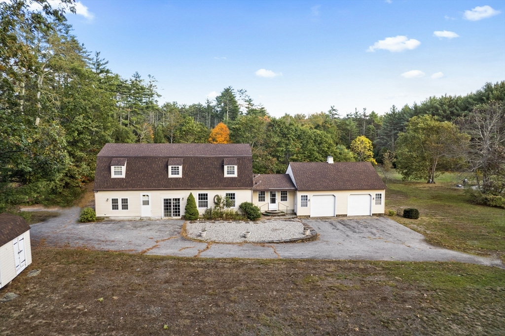 15 South Holden Road Warwick, MA 01378 - Photo 1 of 42 a view of a house with a yard and a large tree