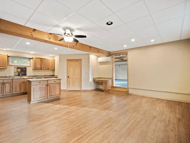 a view of a kitchen with a sink and a stove top oven