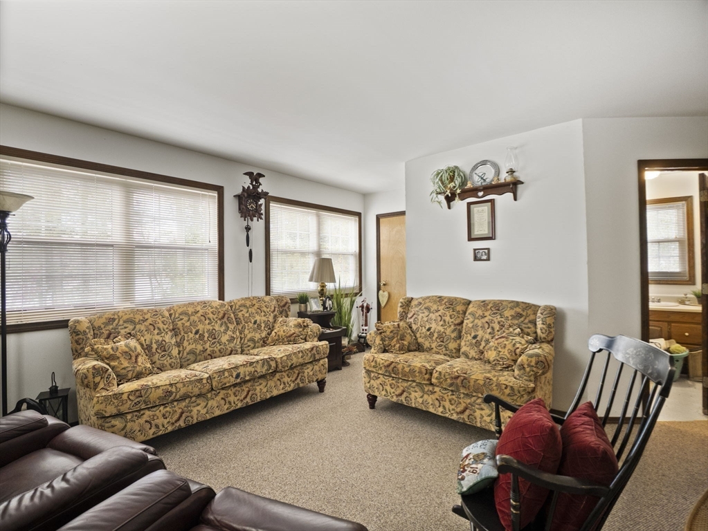 15 South Holden Road Warwick, MA 01378 - Photo 27 of 42 a living room with furniture and a large window