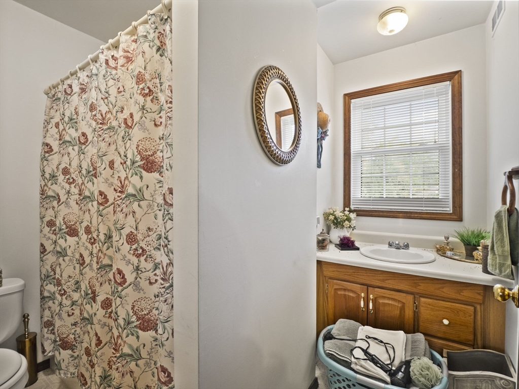 15 South Holden Road Warwick, MA 01378 - Photo 28 of 42 a bathroom with a sink a toilet and a mirror