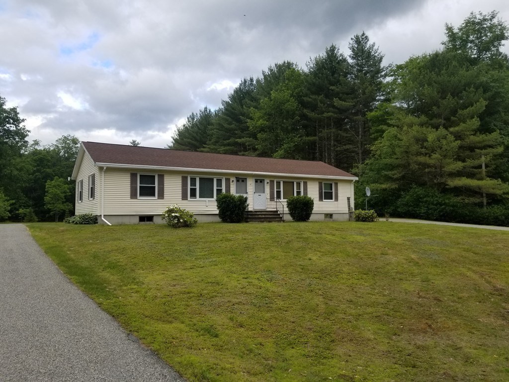 15 South Holden Road Warwick, MA 01378 - Photo 30 of 42 a front view of a house with a garden